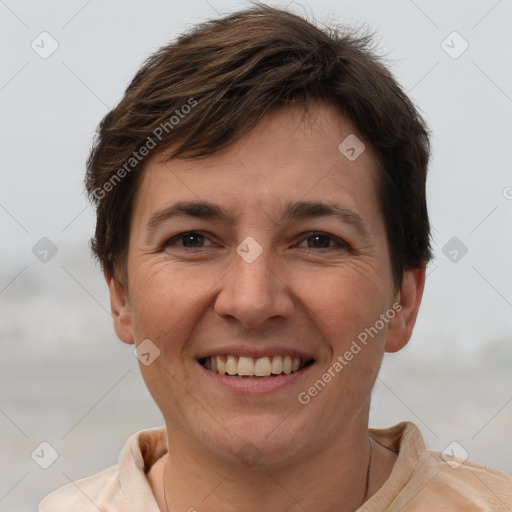 Joyful white adult female with short  brown hair and brown eyes