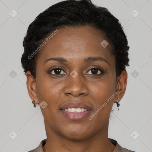 Joyful black young-adult female with short  brown hair and brown eyes