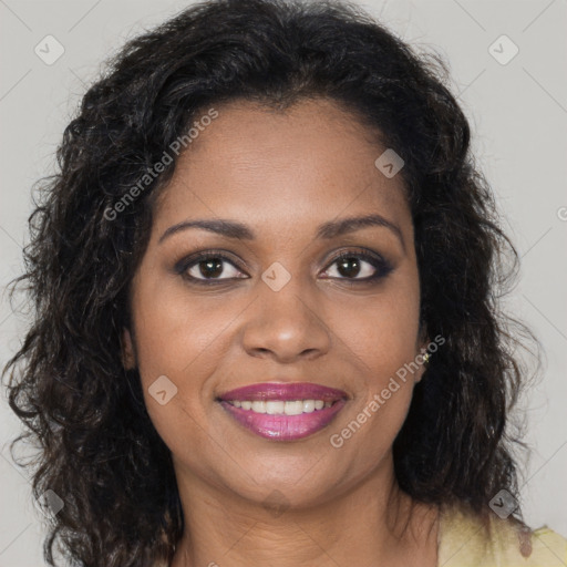 Joyful black young-adult female with long  brown hair and brown eyes