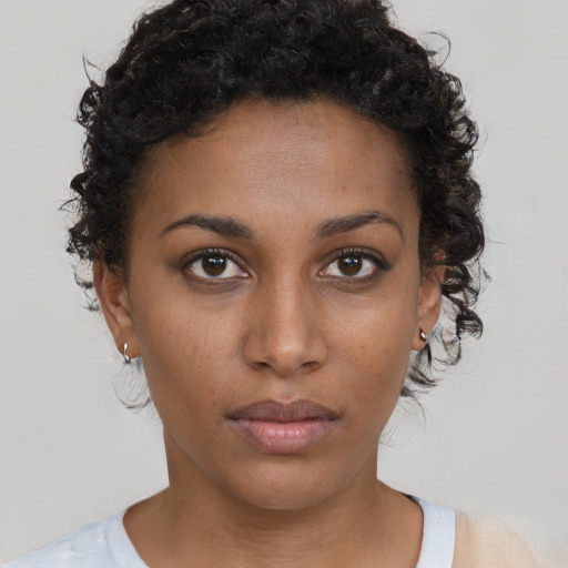 Neutral black young-adult female with short  brown hair and brown eyes