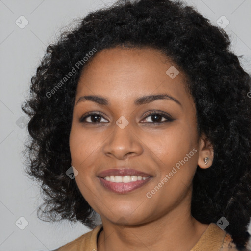 Joyful black young-adult female with long  black hair and brown eyes