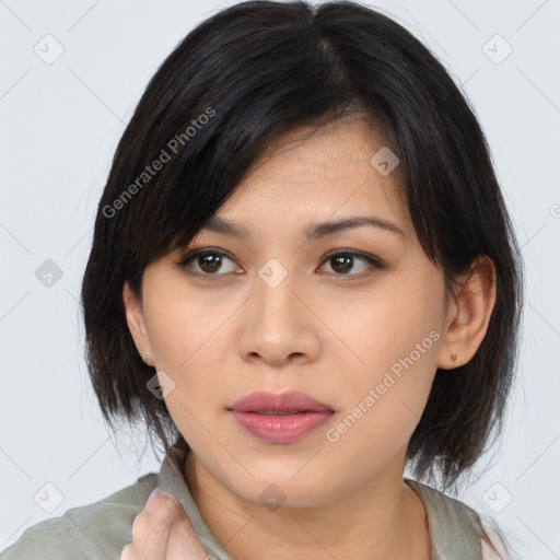 Joyful asian young-adult female with medium  black hair and brown eyes