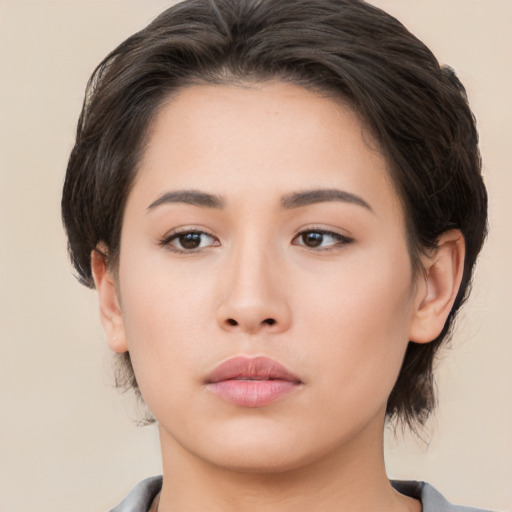 Neutral asian young-adult female with medium  brown hair and brown eyes