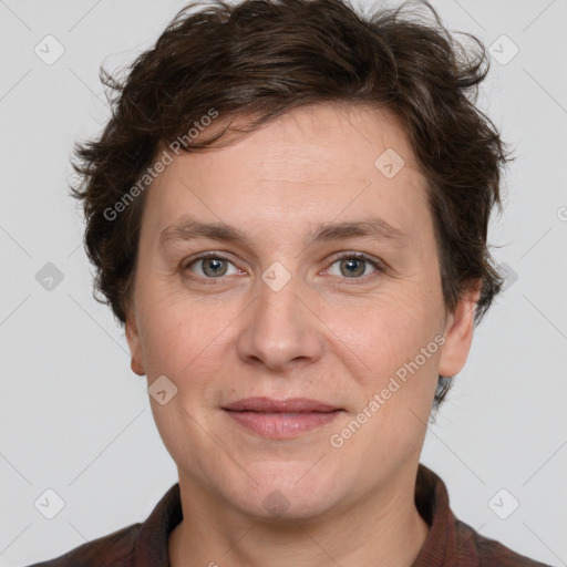 Joyful white adult female with short  brown hair and grey eyes