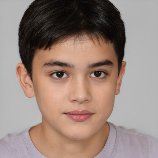 Joyful white child male with short  brown hair and brown eyes