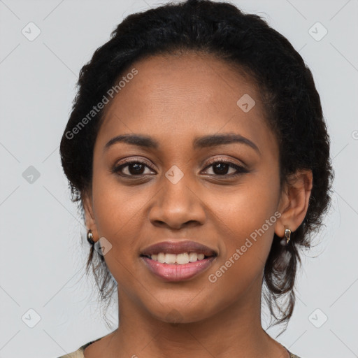 Joyful latino young-adult female with long  black hair and brown eyes