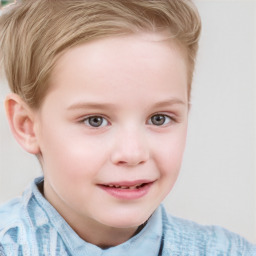 Joyful white child female with short  brown hair and blue eyes