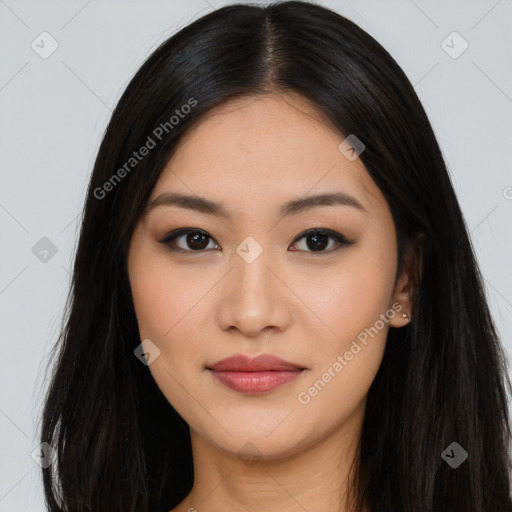 Joyful asian young-adult female with long  black hair and brown eyes