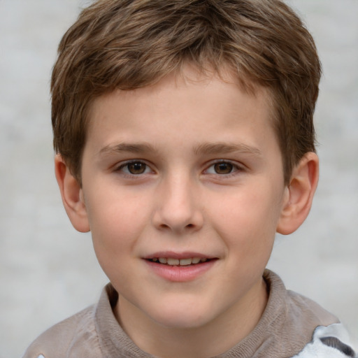 Joyful white child male with short  brown hair and brown eyes