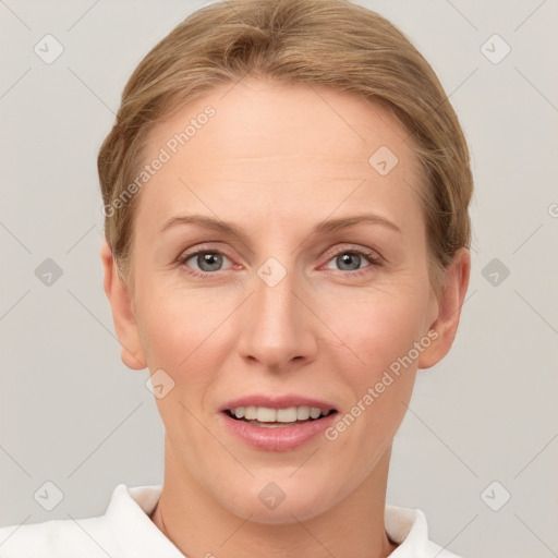 Joyful white adult female with short  brown hair and grey eyes