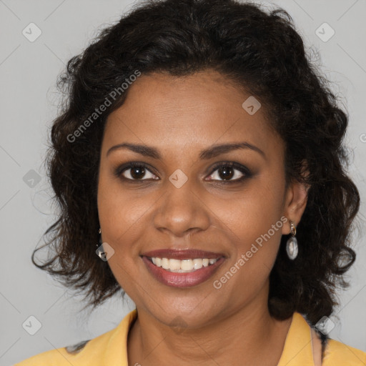 Joyful black young-adult female with long  brown hair and brown eyes