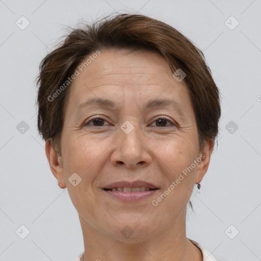 Joyful white adult female with short  brown hair and brown eyes