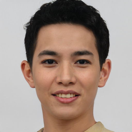 Joyful asian young-adult male with short  black hair and brown eyes