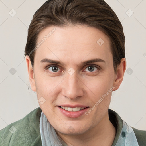 Joyful white young-adult female with short  brown hair and grey eyes