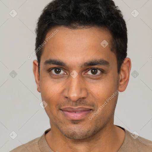 Joyful latino young-adult male with short  black hair and brown eyes