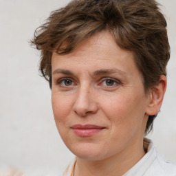 Joyful white adult female with short  brown hair and brown eyes