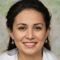 Joyful white adult female with medium  brown hair and brown eyes