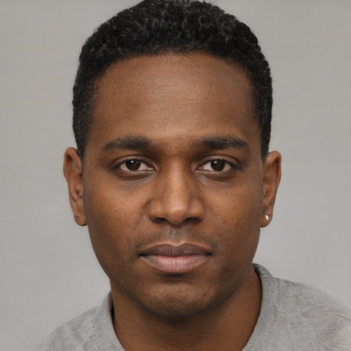 Neutral black young-adult male with short  black hair and brown eyes