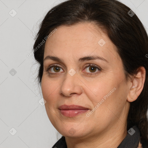 Joyful white adult female with medium  brown hair and brown eyes