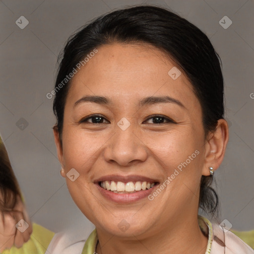 Joyful white adult female with medium  brown hair and brown eyes