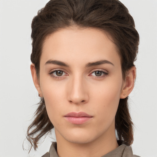 Neutral white young-adult female with medium  brown hair and brown eyes