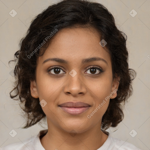 Joyful black young-adult female with medium  brown hair and brown eyes