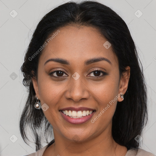 Joyful latino young-adult female with medium  brown hair and brown eyes