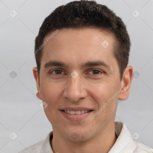 Joyful white young-adult male with short  brown hair and brown eyes