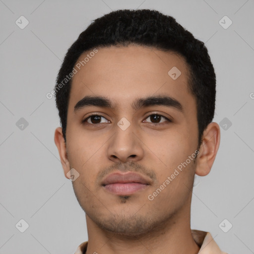 Neutral latino young-adult male with short  black hair and brown eyes