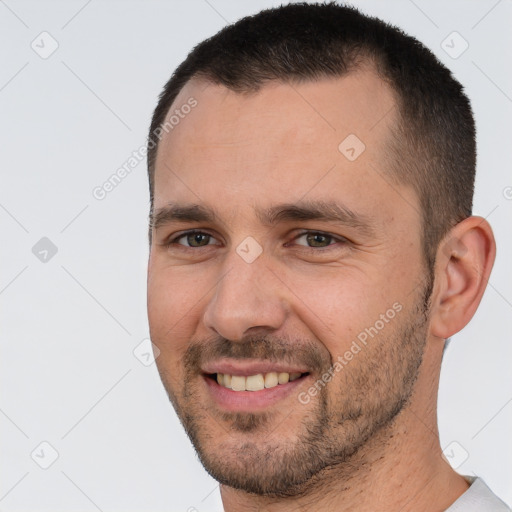 Joyful white young-adult male with short  brown hair and brown eyes