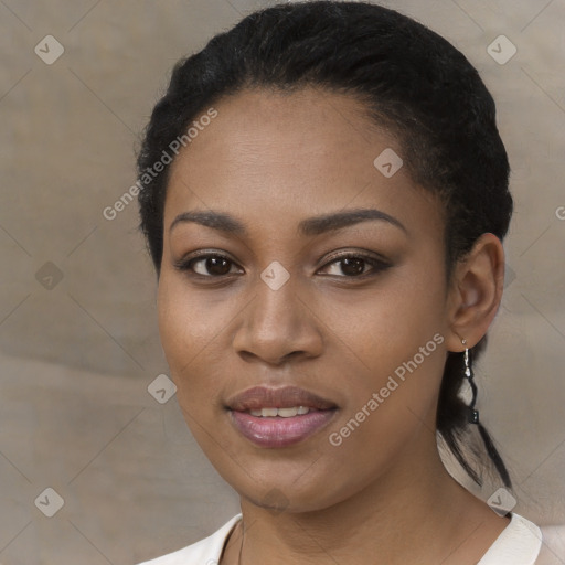 Joyful black young-adult female with short  black hair and brown eyes