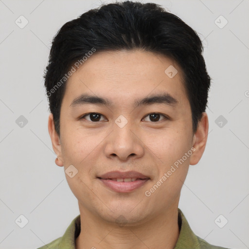 Joyful asian young-adult male with short  black hair and brown eyes