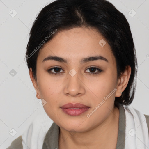 Joyful latino young-adult female with medium  black hair and brown eyes