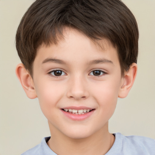 Joyful white child male with short  brown hair and brown eyes