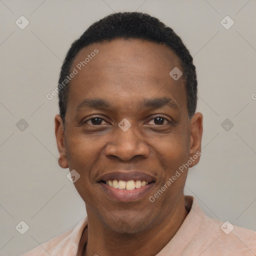 Joyful black adult male with short  black hair and brown eyes