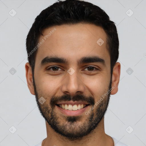 Joyful latino young-adult male with short  black hair and brown eyes