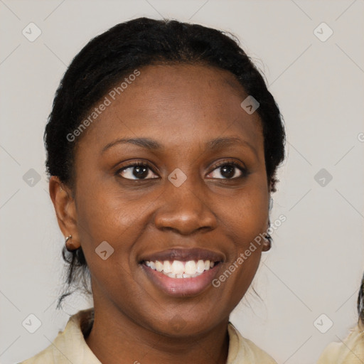 Joyful black young-adult female with medium  brown hair and brown eyes