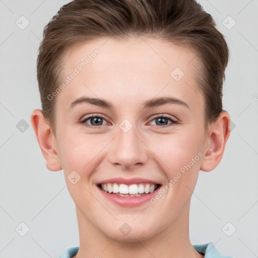 Joyful white young-adult female with short  brown hair and grey eyes