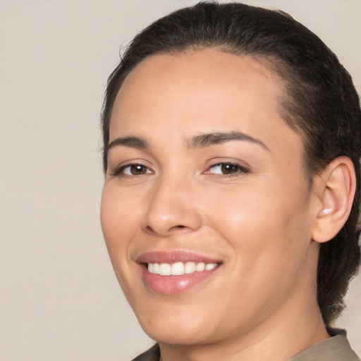 Joyful white young-adult female with medium  brown hair and brown eyes