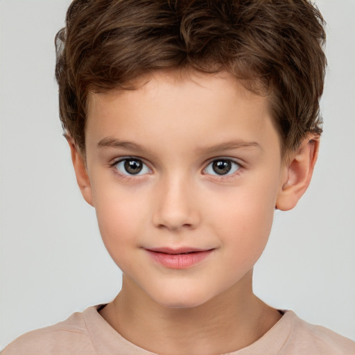 Joyful white child male with short  brown hair and brown eyes