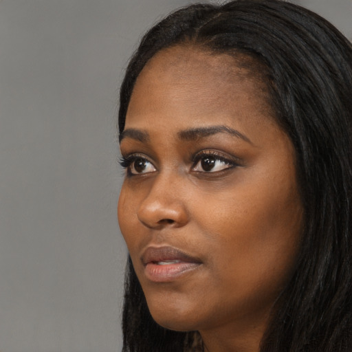 Neutral black young-adult female with long  black hair and brown eyes