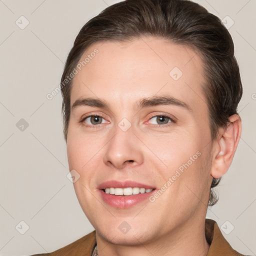 Joyful white young-adult female with short  brown hair and brown eyes