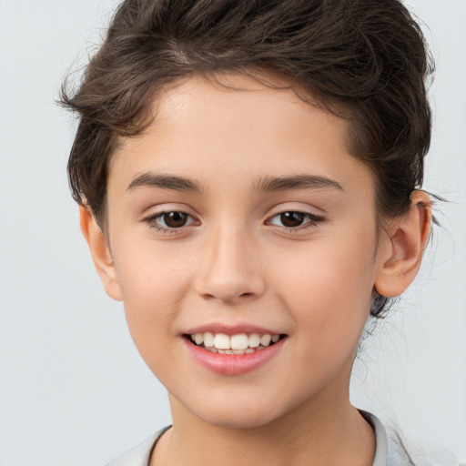 Joyful white child female with short  brown hair and brown eyes