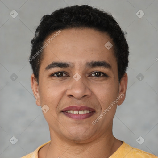 Joyful latino young-adult male with short  brown hair and brown eyes