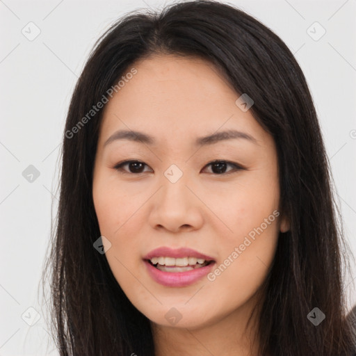 Joyful asian young-adult female with long  brown hair and brown eyes