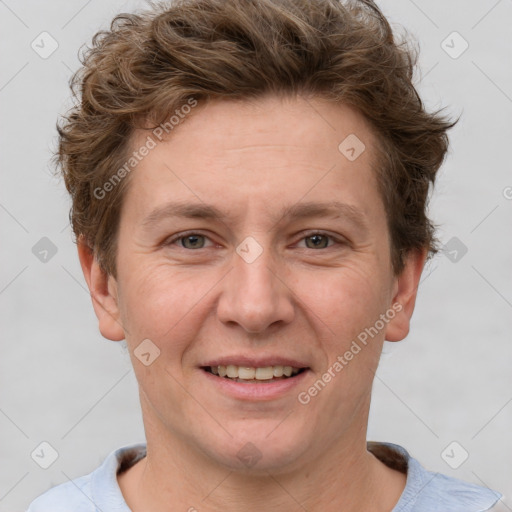 Joyful white adult female with short  brown hair and grey eyes