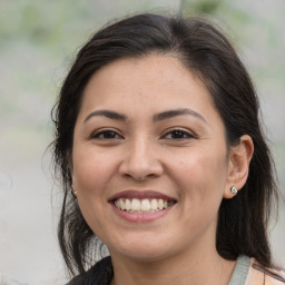 Joyful white adult female with medium  brown hair and brown eyes