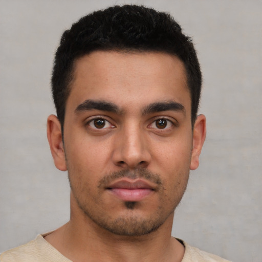 Neutral latino young-adult male with short  black hair and brown eyes