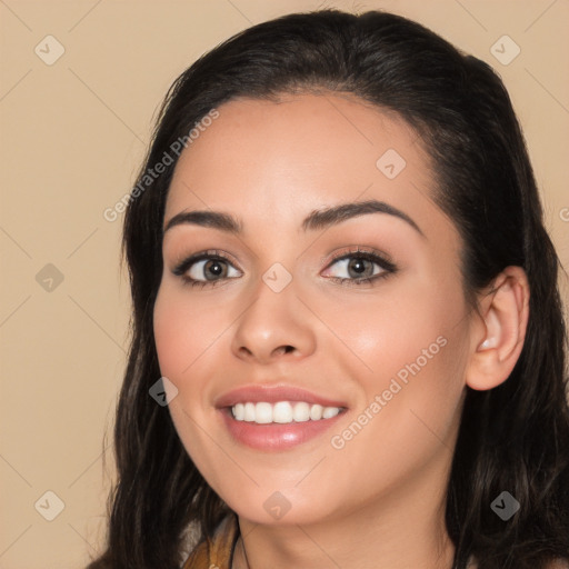 Joyful white young-adult female with long  black hair and brown eyes