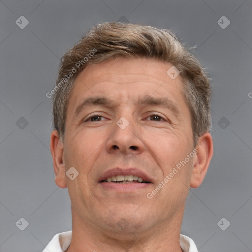 Joyful white adult male with short  brown hair and brown eyes